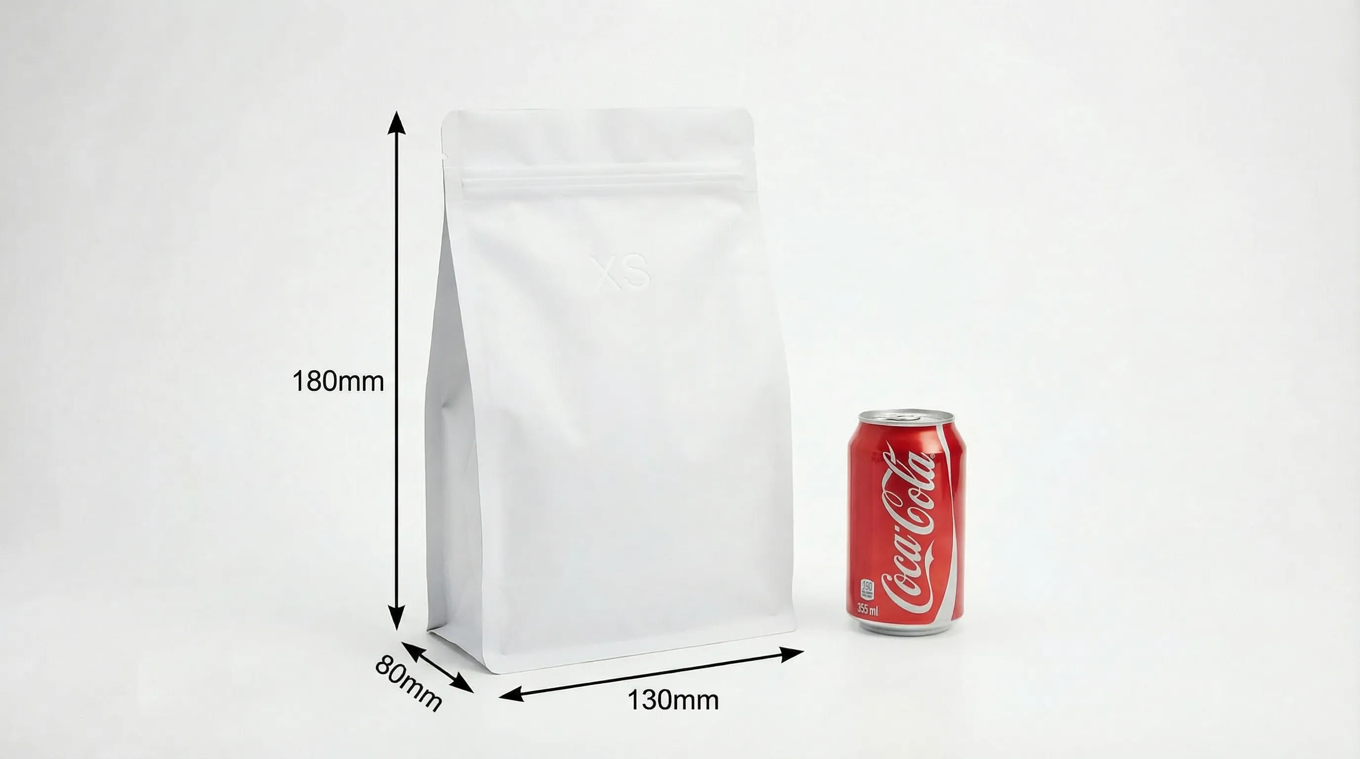 Flat bottom bag size XS compared to cola can